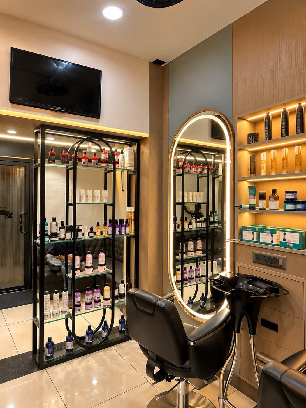 A styling station with an oval LED mirror and product shelves